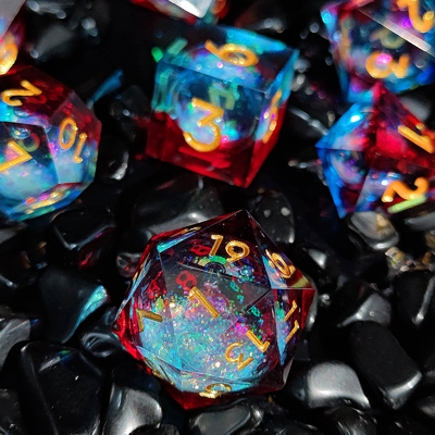 El juego de dados de resina multicolor de arena de flujo