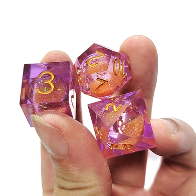 Arenas fluidas naranjas moradas Resina de cristal poliédrica Conjunto de dados de juego de tabletas